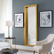 Gold Edmonton Leaner Mirror by Uttermost, floor mirror with a sleek, modern design and a polished gold frame.