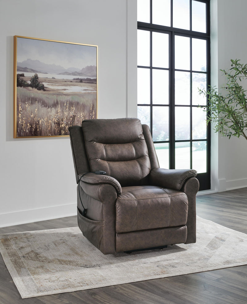 Signature Design by Ashley Oatman power lift recliner in plush fabric with padded armrests and built-in lift mechanism.
