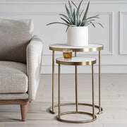 Uttermost Aragon nesting accent tables set of 2 with sleek wooden tops and metal legs, ideal for modern living spaces.