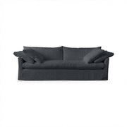Classic Home Cassiano slip cover sofa with plush cushions and neutral fabric, showcasing a stylish stationary sofa design.