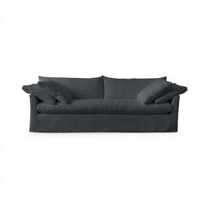 Classic Home Cassiano slip cover sofa with plush cushions and neutral fabric, showcasing a stylish stationary sofa design.