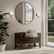 Brown Simpli-Home Acadian Entryway Storage Bench with shelf, showing a wooden bench with a cushioned seat and open shelf underneath.