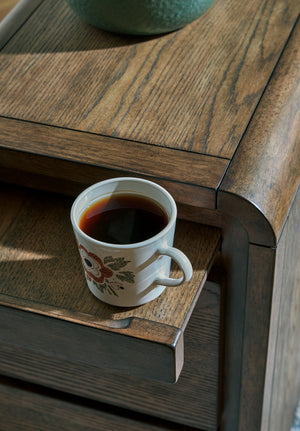 Brown Jensworth Accent Table by Signature Design Ashley, showcasing a stylish wooden surface and modern design.