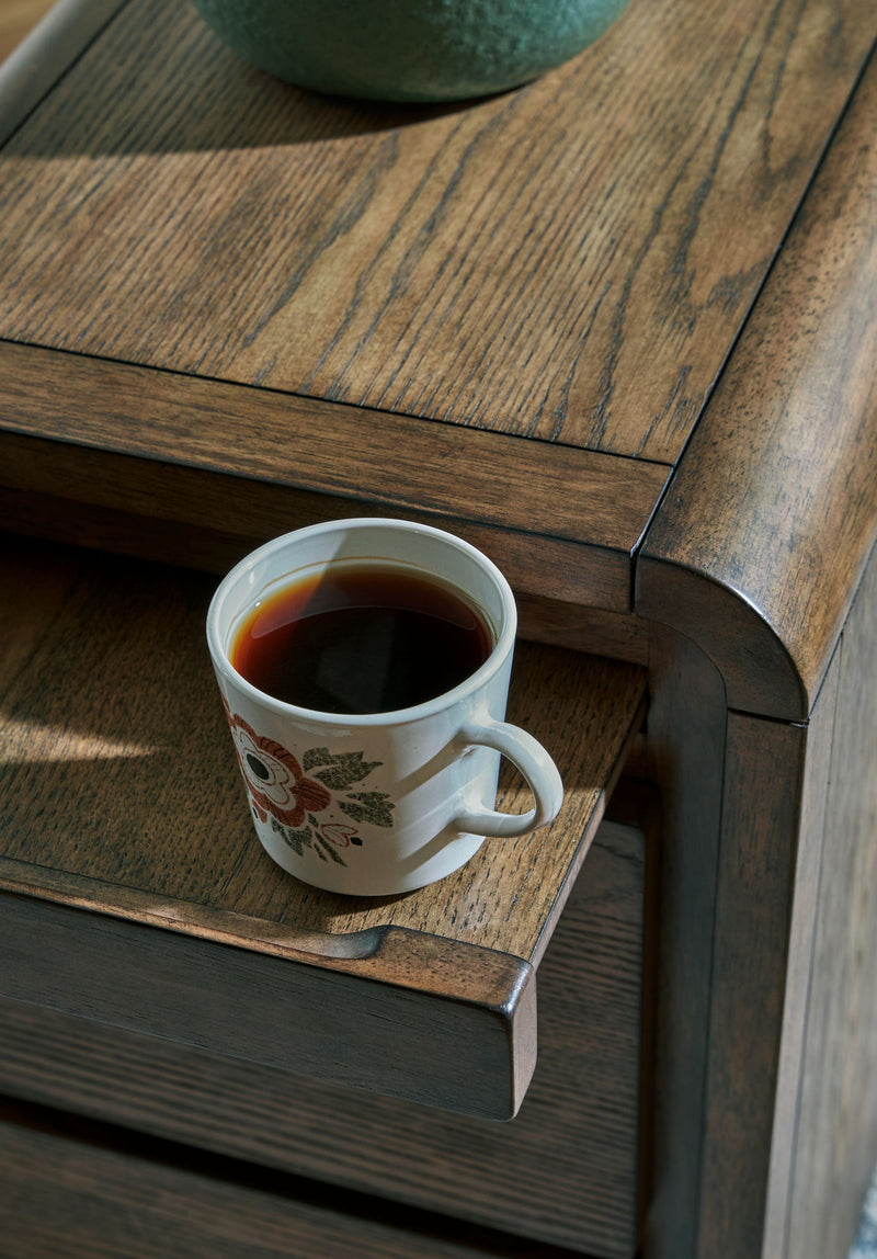 Brown Jensworth Accent Table by Signature Design Ashley, showcasing a stylish wooden surface and modern design.
