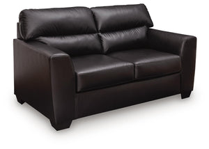 Midnight Glennbre stationary loveseat by Signature Design by Ashley® with plush cushions and modern design, shown in a cozy living room setting.