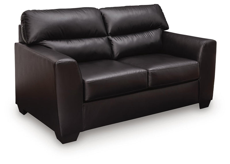 Midnight Glennbre stationary loveseat by Signature Design by Ashley® with plush cushions and modern design, shown in a cozy living room setting.