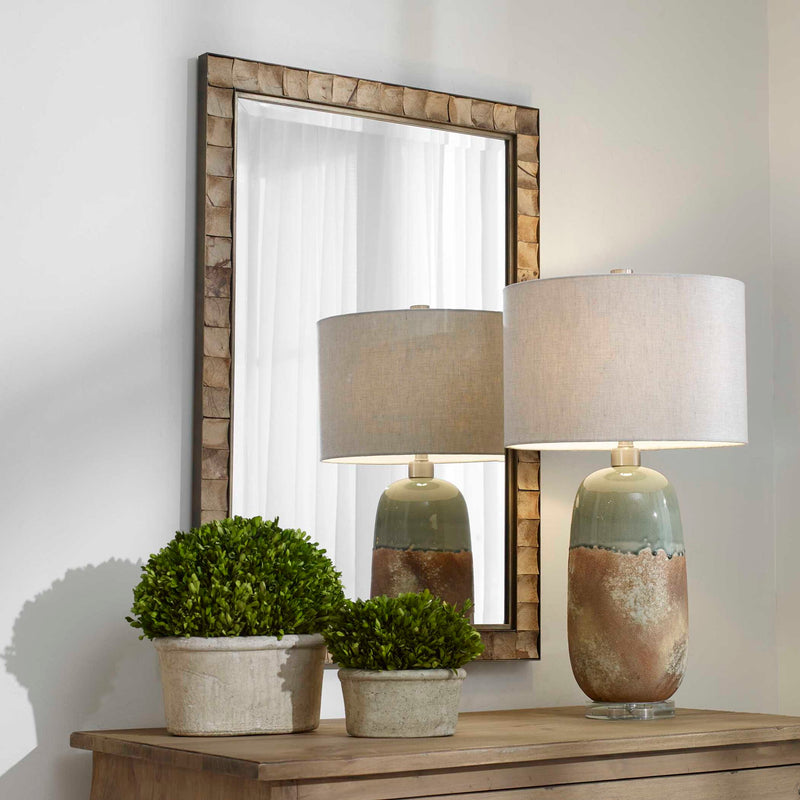 Light brown coconut shell accent mirror by Uttermost with natural textured frame, perfect for coastal or tropical decor.