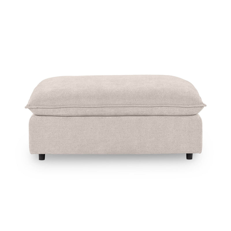 Classic Home Caplan upholstered ottoman with a plush fabric cover and sturdy wooden legs, perfect as a versatile footrest or accent piece.