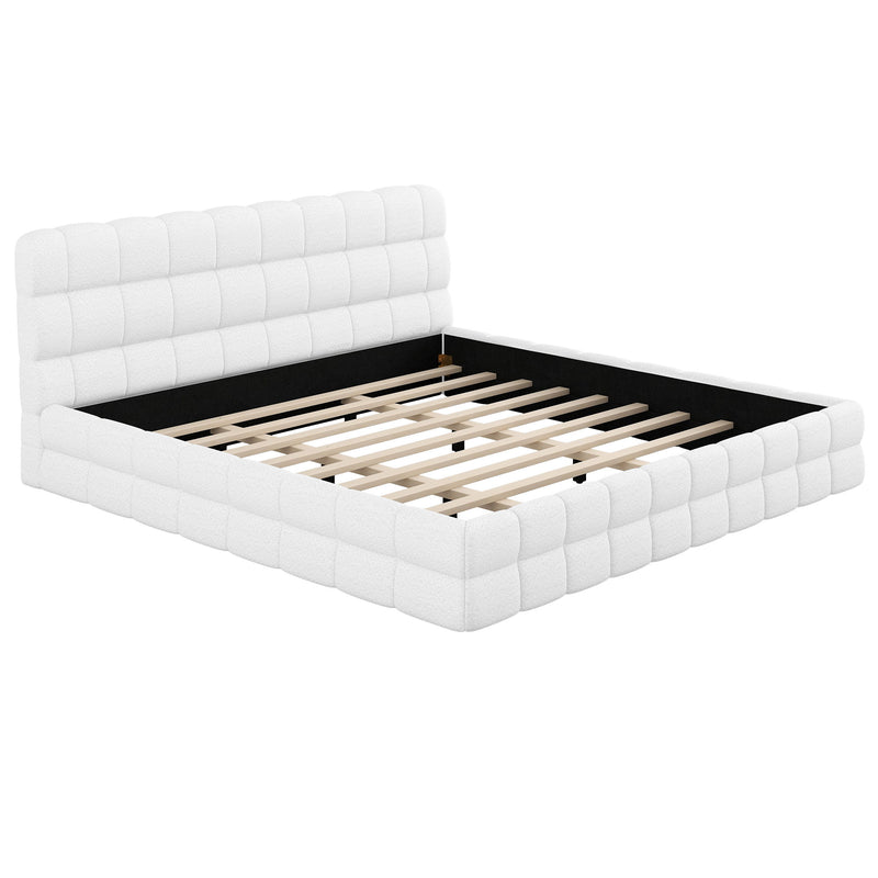 Dreamland upholstered platform bed with padded headboard, featuring a sleek fabric finish and modern design for a comfortable bedroom.