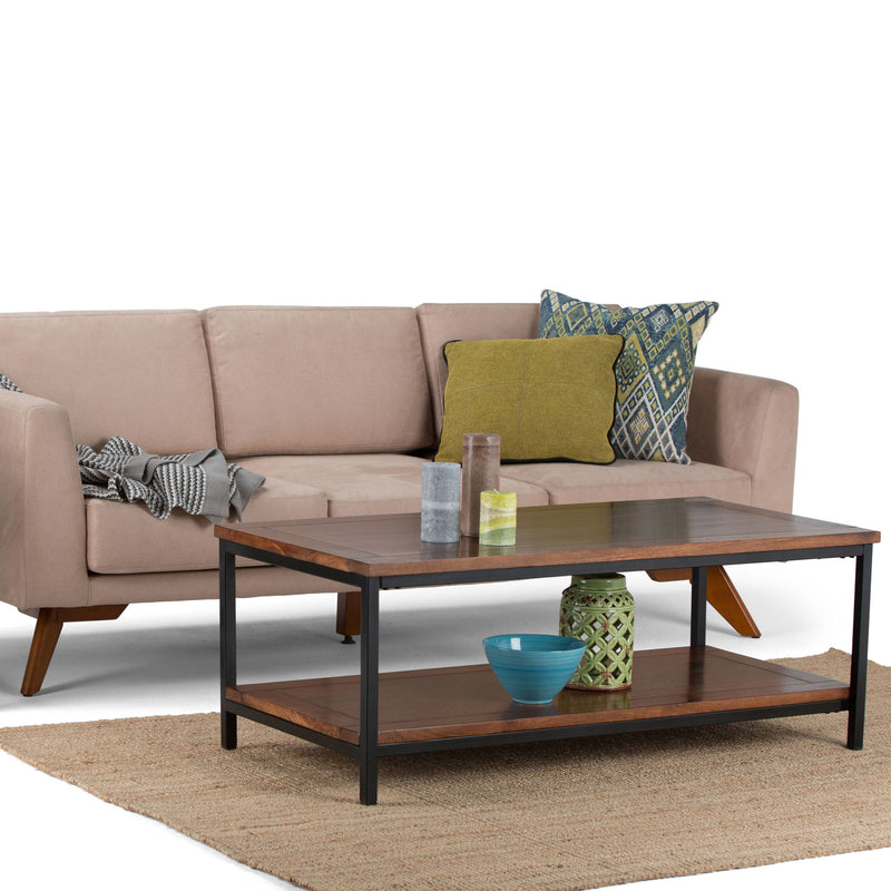 Simpli-Home Skyler coffee table in dark cognac brown wood with a modern rectangular design and sturdy legs.