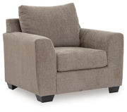 Benchcraft® arm chair with plush fabric upholstery and modern design, featuring a supportive back and comfortable armrests.