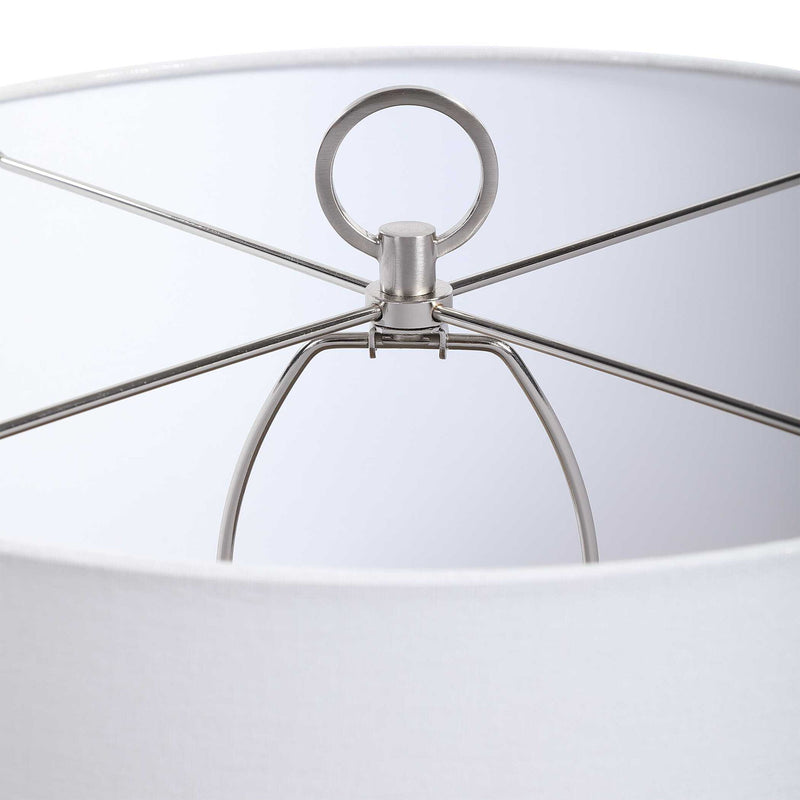 Uttermost Cyprien gray and white table lamp with a sleek, modern design and smooth ceramic finish.