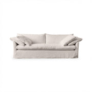 Classic Home Cassiano slip cover sofa in a cozy living room, showcasing a stylish stationary sofa with a tailored fabric cover.