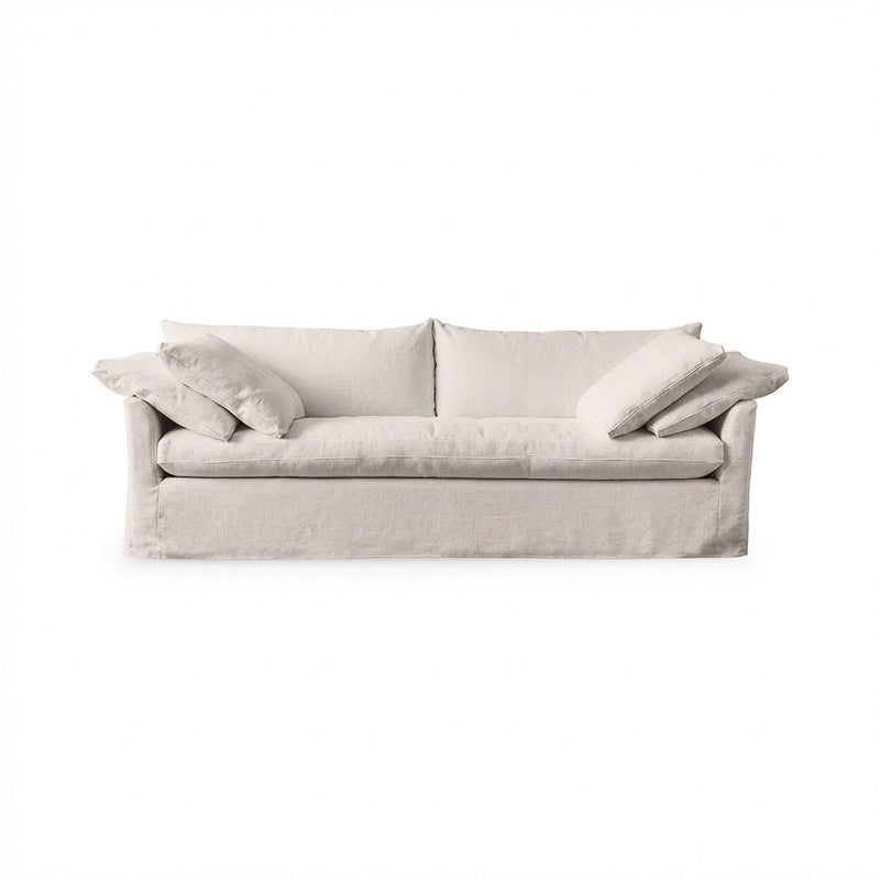 Classic Home Cassiano slip cover sofa in a cozy living room, showcasing a stylish stationary sofa with a tailored fabric cover.