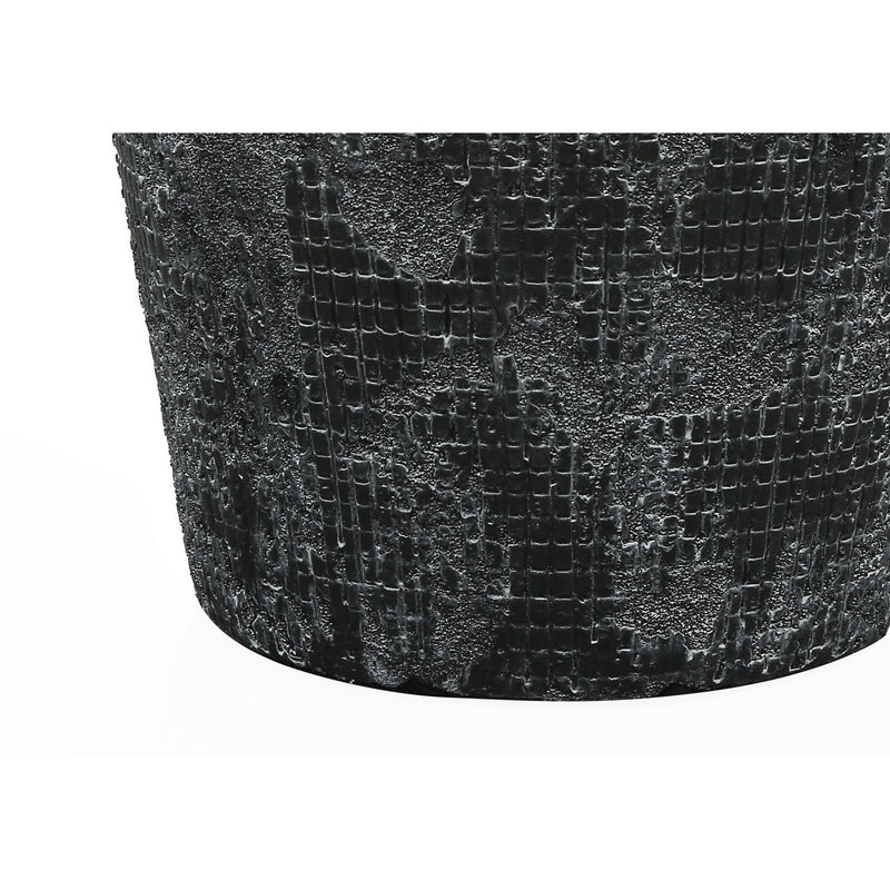 Contemporary black 8th Street table lamp with a sleek design and modern lighting, placed on a wooden surface.