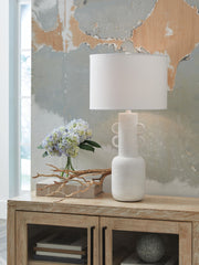 Distressed white metal table lamp from Perringhill collection by Signature Design, with a classic, rustic style.