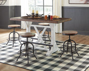 Rectangular white and brown Valebeck dining room counter table by Signature Design Ashley, showing a modern wooden table with clean lines.