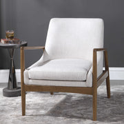White Bev accent arm chair by Uttermost with a sleek, modern design and plush upholstery.