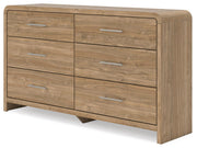 Signature Design by Ashley Six Drawer Dresser with sleek wood finish and modern handles, showcasing its spacious storage drawers.