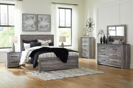 Signature Design by Ashley Bronyan 5-piece bedroom set with bed frame, dresser, mirror, nightstands, and matching decor in a modern style.