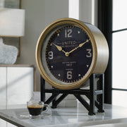 Black Shyam tabletop clock by Uttermost featuring a sleek, modern design with a round face and minimalist style.