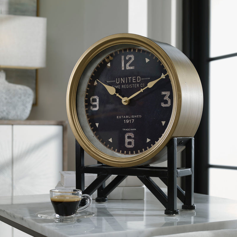 Black Shyam tabletop clock by Uttermost featuring a sleek, modern design with a round face and minimalist style.