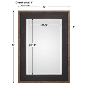 Uttermost Staveley rustic black wall mirror with a textured wooden frame, ideal for modern or farmhouse decor styles.