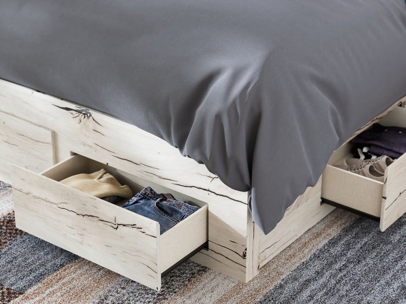 Signature Design by Ashley Lawroy panel bed with built-in storage drawers in a modern bedroom setting.