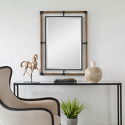 Uttermost Melville iron and rope wall mirror in light brown with a rustic, nautical design featuring a round shape and textured frame.
