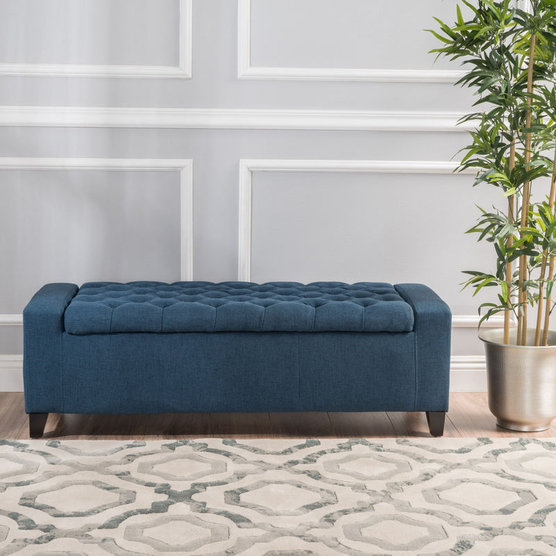 Noble House Guernsey storage ottoman with tufted top and wooden legs, versatile ottoman for living room or bedroom.