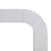 TOV Furniture Hump console table with a sleek modern design, featuring a wooden top and minimalist metal legs.