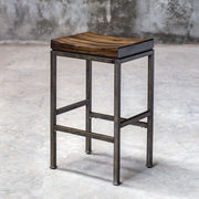 Beck industrial counter height bar stool by Uttermost with metal frame and wooden seat, ideal for modern kitchen or bar area.