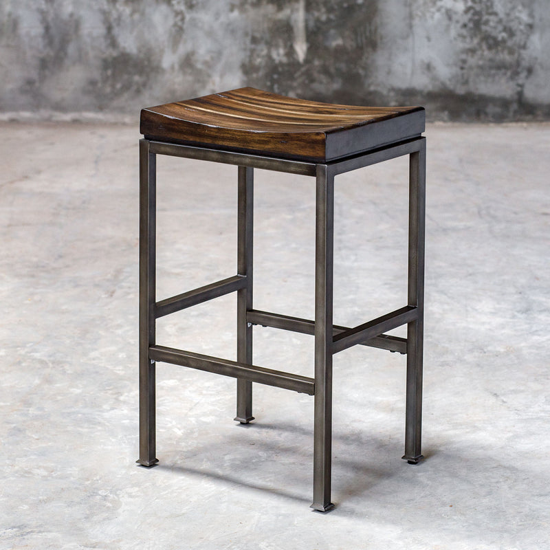 Beck industrial counter height bar stool by Uttermost with metal frame and wooden seat, ideal for modern kitchen or bar area.