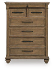 Medium brown Karallin seven-drawer accent chest by Signature Design by Ashley®, showing a stylish wooden storage piece with multiple drawers.