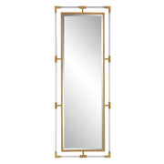 Uttermost Balkan Iron Wall Mirror with a decorative iron frame, hanging on a wall in a stylish interior setting.