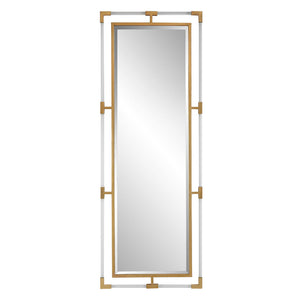 Uttermost Balkan Iron Wall Mirror with a decorative iron frame, hanging on a wall in a stylish interior setting.