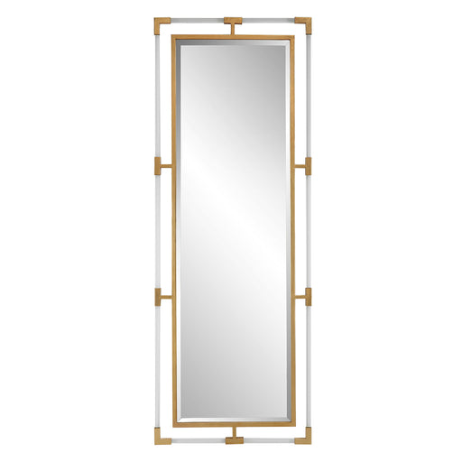 Uttermost Balkan Iron Wall Mirror with a decorative iron frame, hanging on a wall in a stylish interior setting.