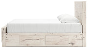 Signature Design by Ashley Lawroy panel bed with built-in storage drawers in a modern bedroom setting