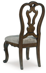 Signature Design by Ashley Maylee 11-piece dark brown dining set with extension table, 4 side chairs, 2 arm chairs, storage bench, buffet, and hutch.