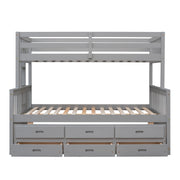 DreamHaus bunk bed with twin-size trundle and built-in drawers, featuring sturdy wood construction and space-saving design.