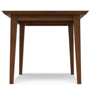 Contemporary Colby dining table by Simpli-Home with a sleek wooden surface and sturdy legs, ideal for modern dining rooms.