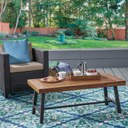 Noble House Carlisle industrial coffee table with natural wood finish and slat panel design, modern and sturdy living room furniture.