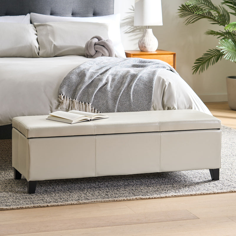 Noble House Glouster contemporary storage ottoman with a cushioned top and wooden legs, versatile for living room seating and storage.