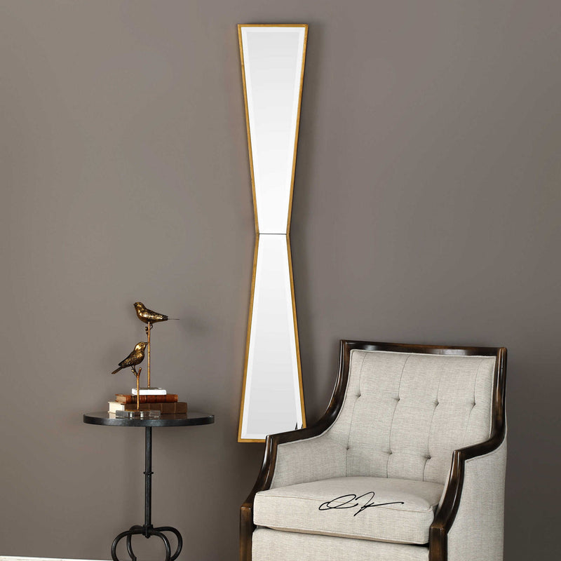 Gold mirror wall decor by Uttermost featuring a sleek, reflective surface and a contemporary mirror design.