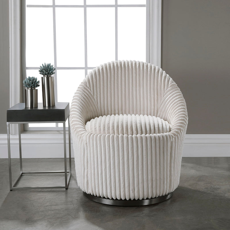 Uttermost Crue Fabric Swivel Chair with cushioned seat and modern design, shown in a stylish living room setting.