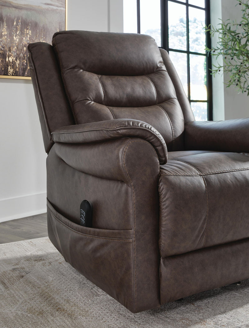 Signature Design by Ashley Oatman Power Lift Recliner in brown fabric, showcasing plush cushioning and sturdy wooden base.