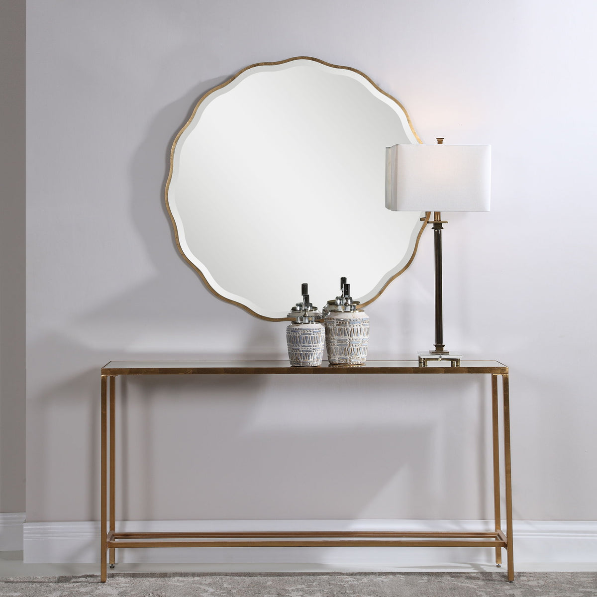 Uttermost Aneta round wall mirror with a sleek frame, perfect for modern interior decor and home accents.