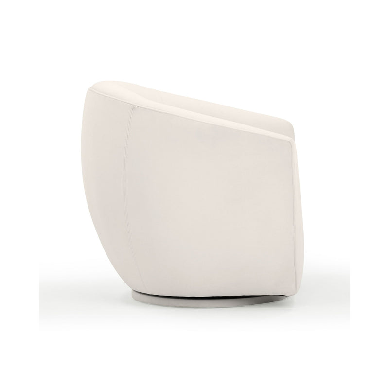 TOV Furniture Jordan velvet swivel chair with a rounded back and plush upholstery in a modern design.