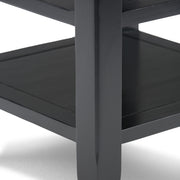Handcrafted Acadian end table by Simpli-Home with a wooden finish, featuring a simple rectangular top and sturdy legs.