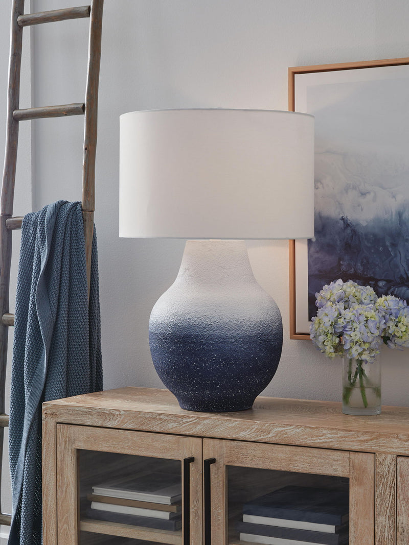 White and navy metal table lamp from Signature Design by Ashley, featuring a modern design perfect for living spaces.